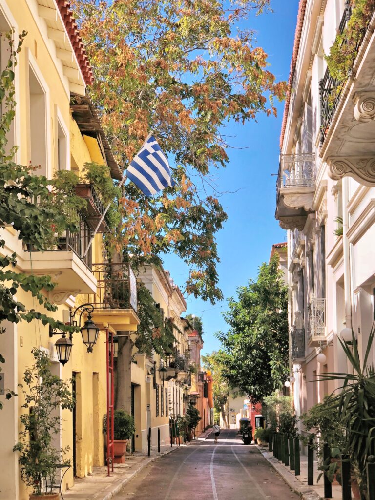 stunning old architectural buildings on a quiet, empty street in Athens, Greece