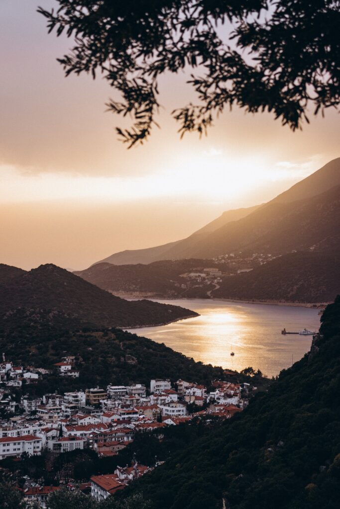 stunning sunset setting in along the sea and wide mountainous ranges in Kas, Turkey 