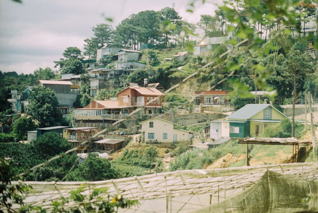 several homes sitting on the hills in a rural village close to Dalat, Vietnam