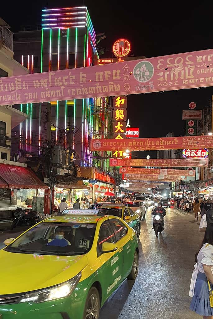 a taxi driving by in China Town in Bangkok, Thailand