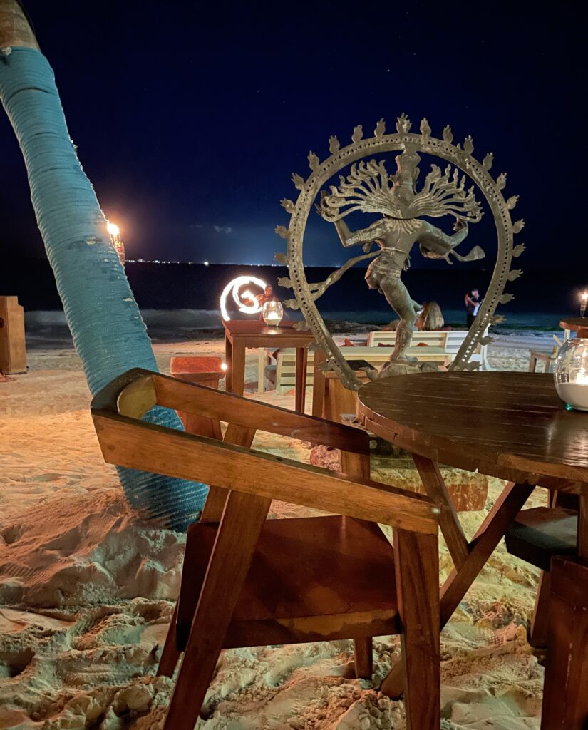 fire performer performing on the beach at Lido Beach Club in the night in Playa del carmen, Mexico