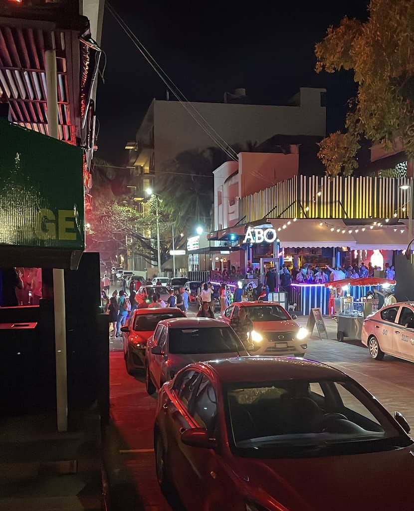 popular area for nightclubs, several tourist coming in and out of nightclubs in Playa del carmen