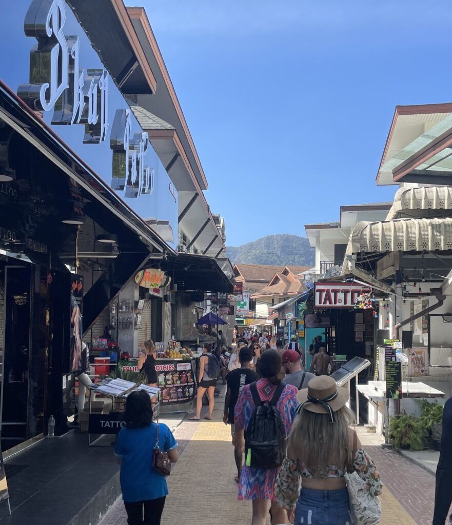 several tourist wondering the busy streets of Phi Phi Don