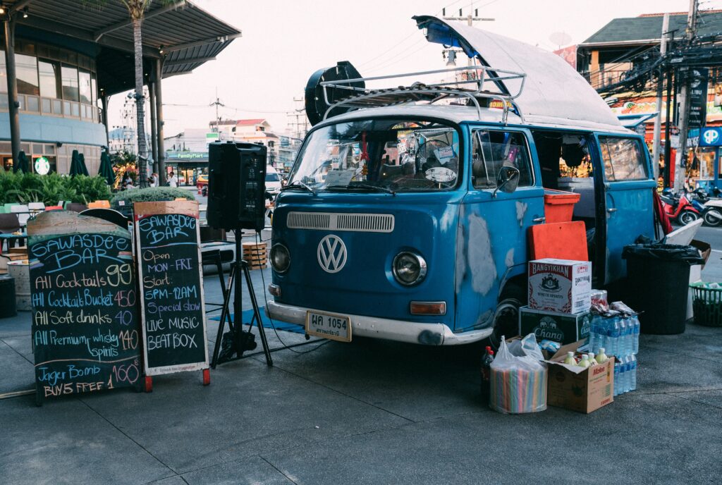 old Volkswagen bus transformed into a bar selling many cocktails, and fresh drinks on the streets of Koh Samui