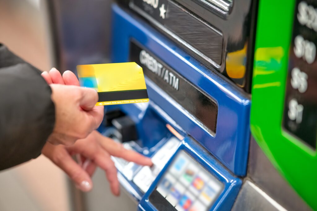 person using an ATM with their card