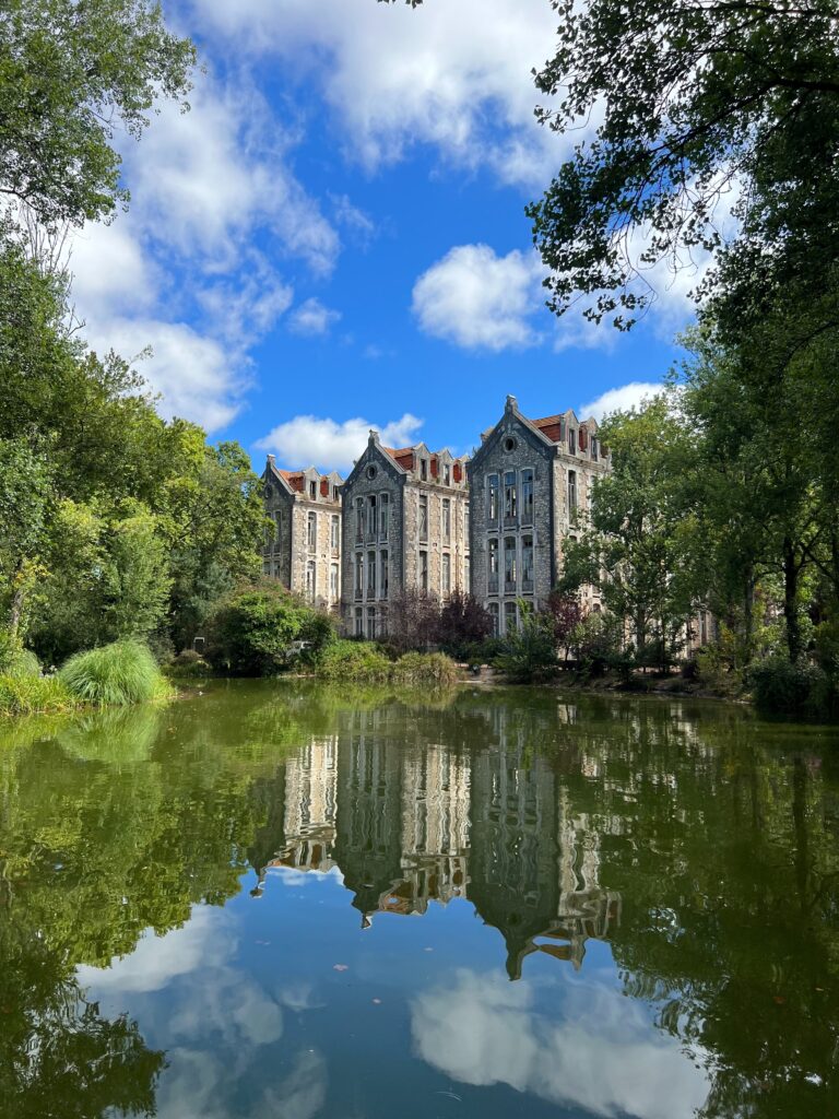 small pond along stunning architectural buildings at a famous park in Caldas da Rainha, Portugal   