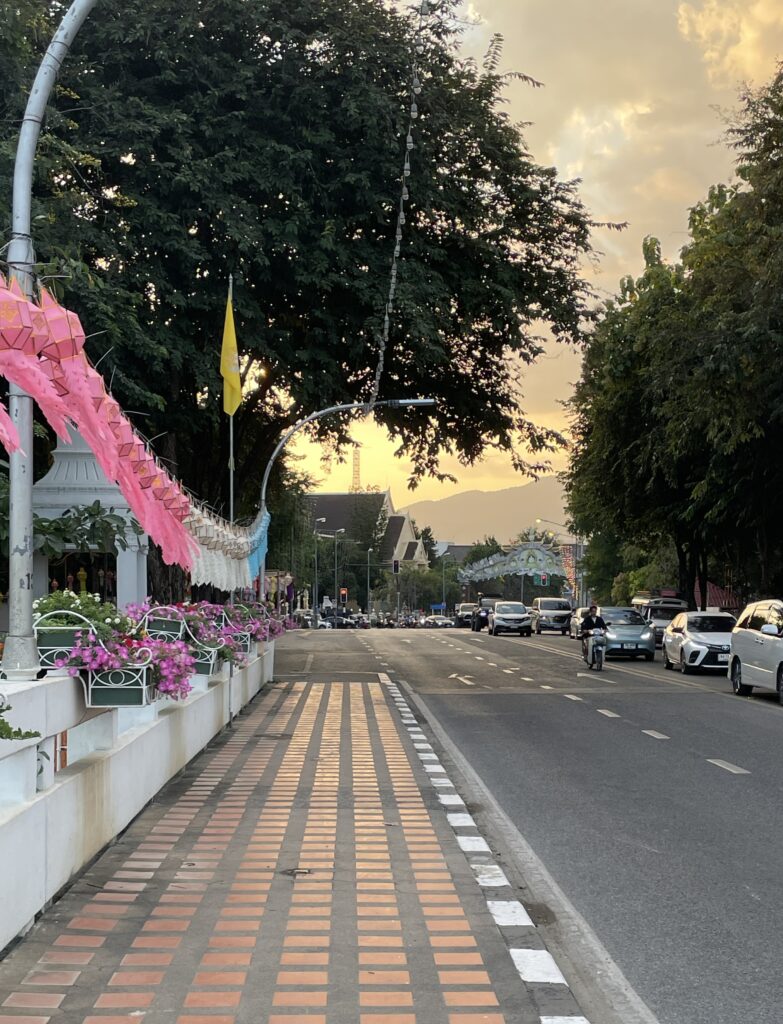 bridge featuring decorations for the Lantern Festival during a vibrant sunset in the evening in Chiang Mai, Thailand / Chiang Mai Airport to Old City