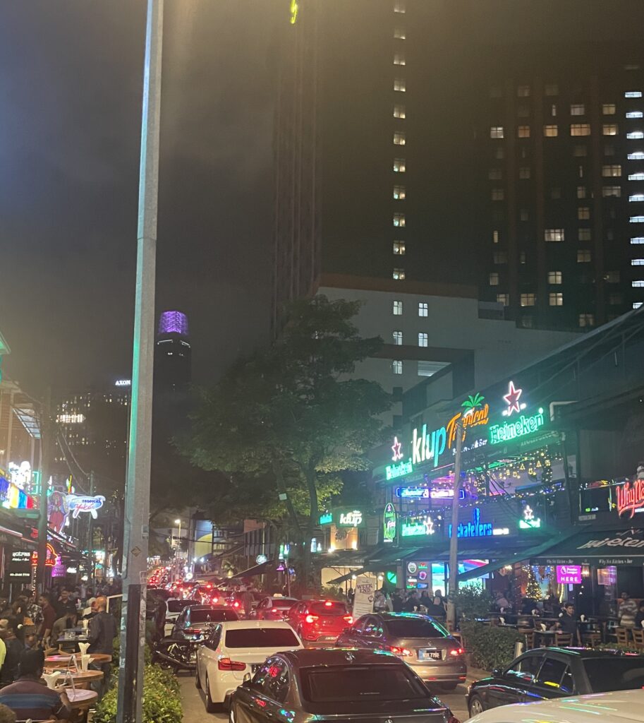 a popular vibrant nightlife street in Kuala Lumpur at night where countless bars are