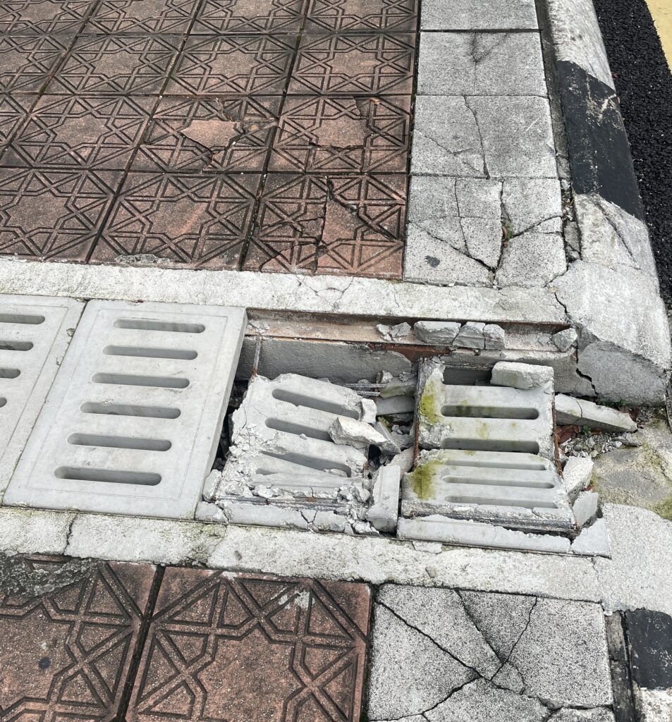 damaged street sidewalk in Kuala Lumpur