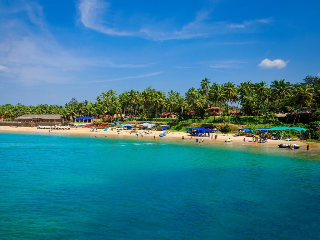 crystal clear waters along a stunning tropical beach shoreline in Goa, India 