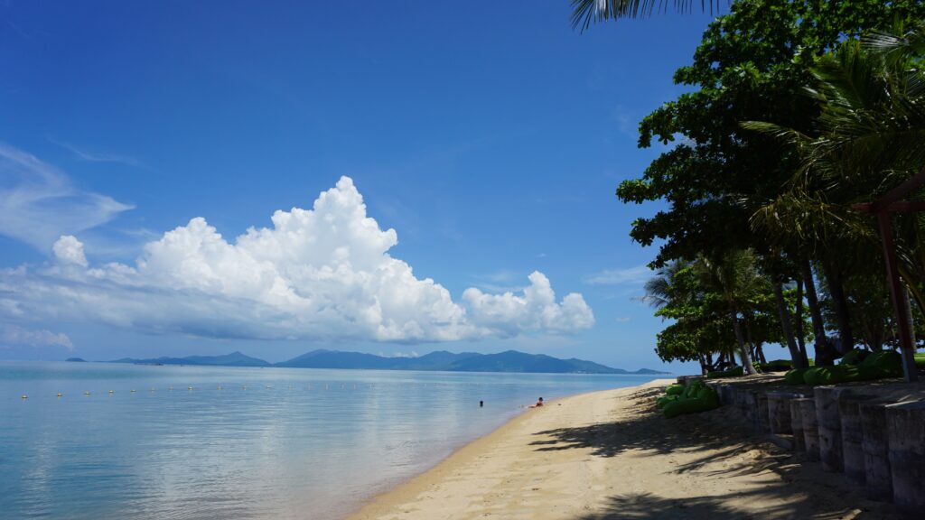 a quiet empty beach shoreline in Koh Samui on a beautiful sunny day / Is Koh Samui safe to visit