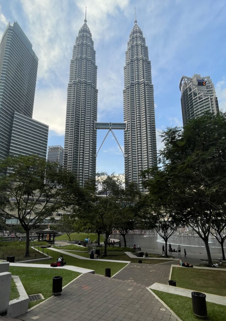 the famous petronas towers in Kuala Lumpur amongst the KLCC Park on a sunny day 