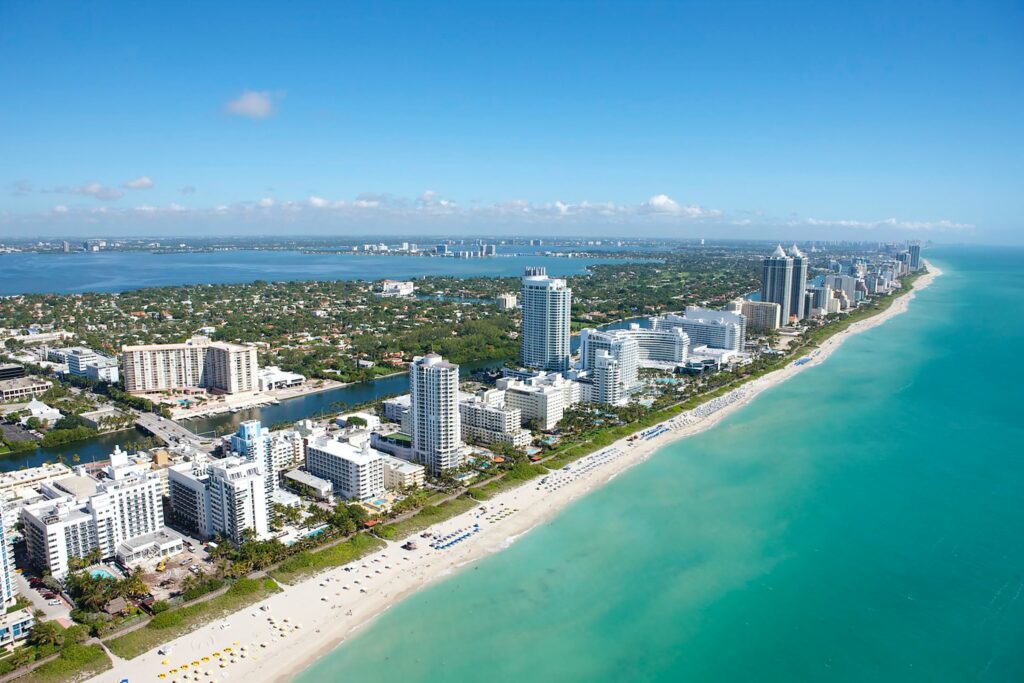 aerial views of several tall condos along Miami's beautiful extensive shorelines