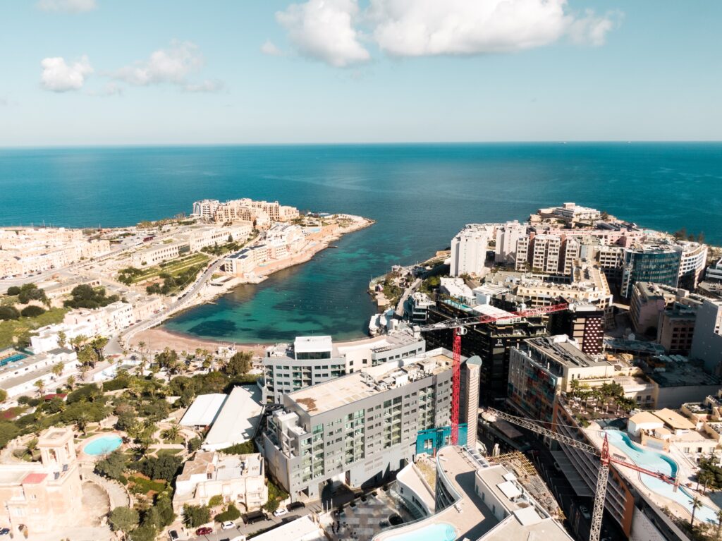 views of many buildings and a charming coastline in Paceville, Malta 