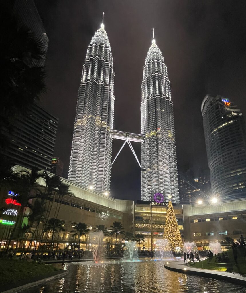 the world famous Petronas Towers lit up bright in the night  