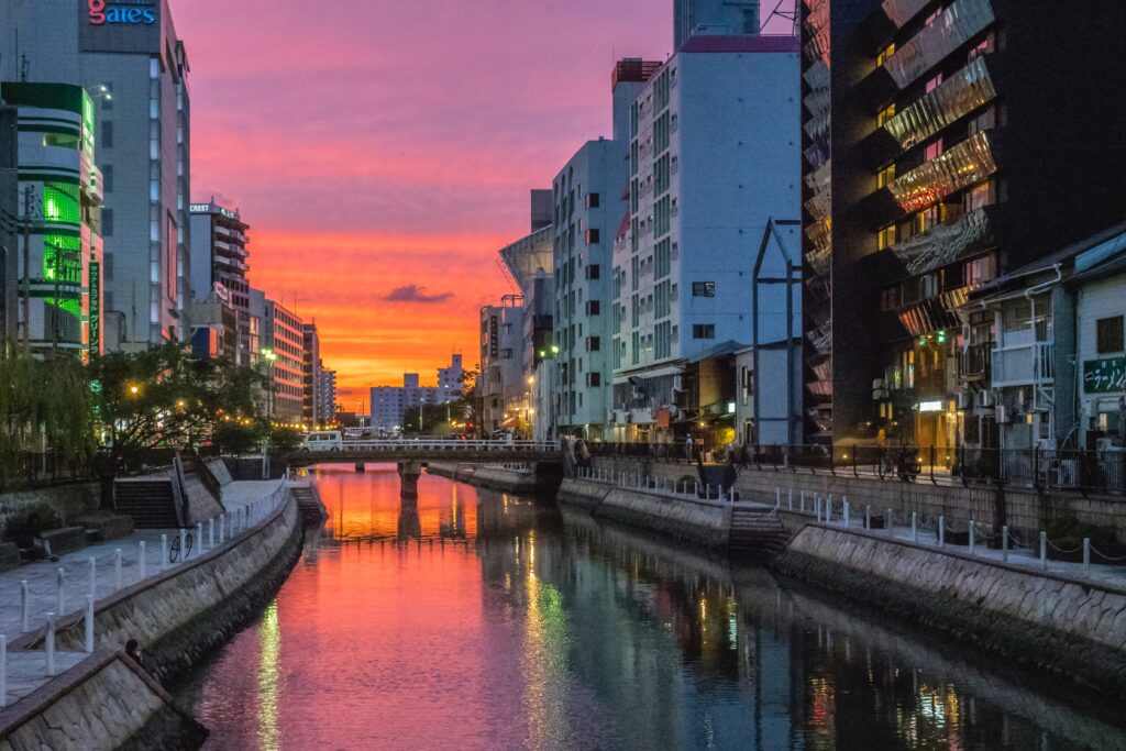 vibrant colour sunset setting in amongst the river in Fukuoka, Japan