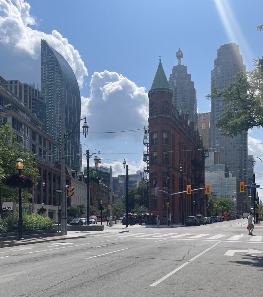 known picturesque intersection in downtown Toronto on a sunny day with clear clouds 
