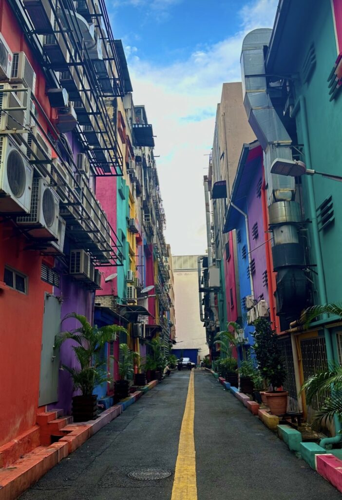 a popular street in Brickfields aka Little India showing several vibrant colourful painted homes 