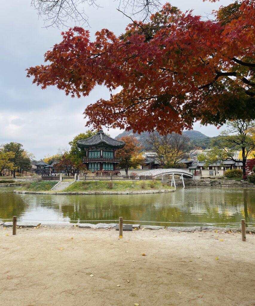 the stunning pond and old palace buildings at Gyeongbokgung Palace in Seoul, South Korea