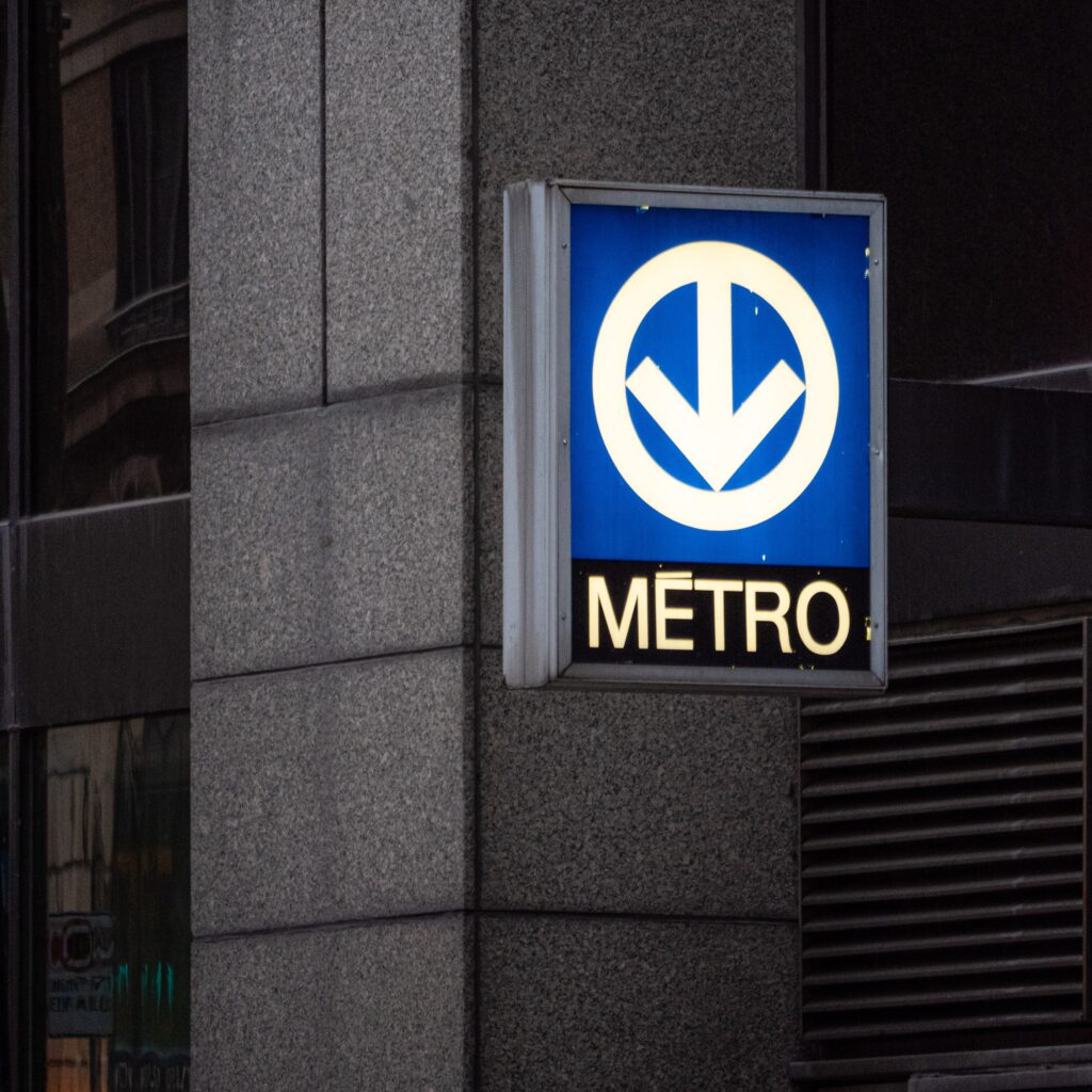 a metro sign on the street in Montreal suggesting where the Metro/Subway is downtown, Montreal 