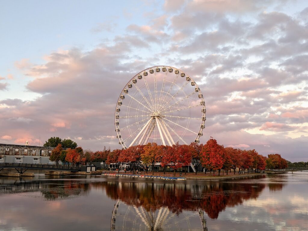 cotton candy skies amongst the famous large ferris wheel in Montreal during the Fall