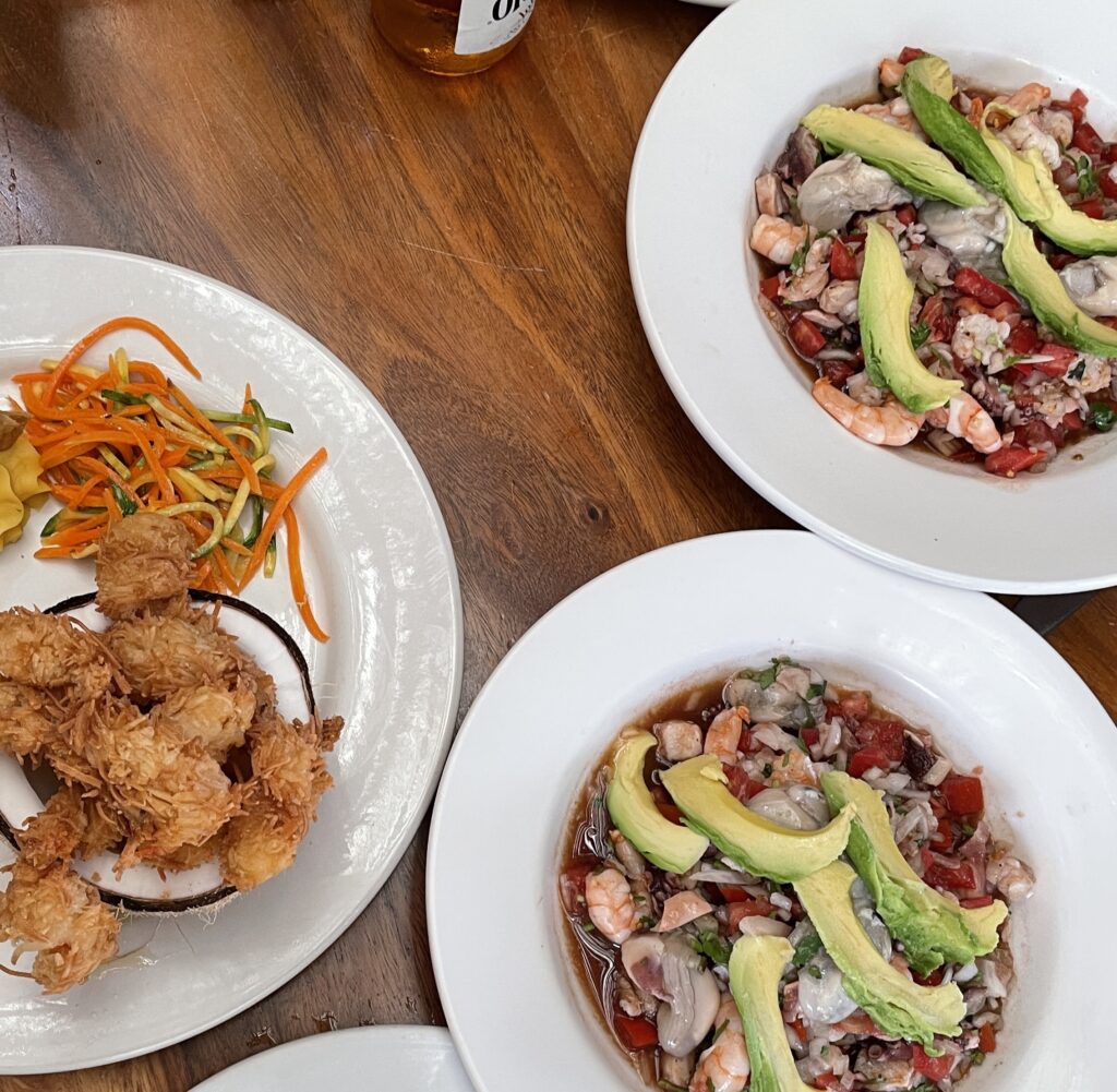 two plates of Mexican ceviche being served at a restaurant in Mexico