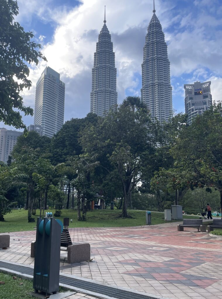 views of the twin Petronas Towers from KLCC Park in Kuala Lumpur  