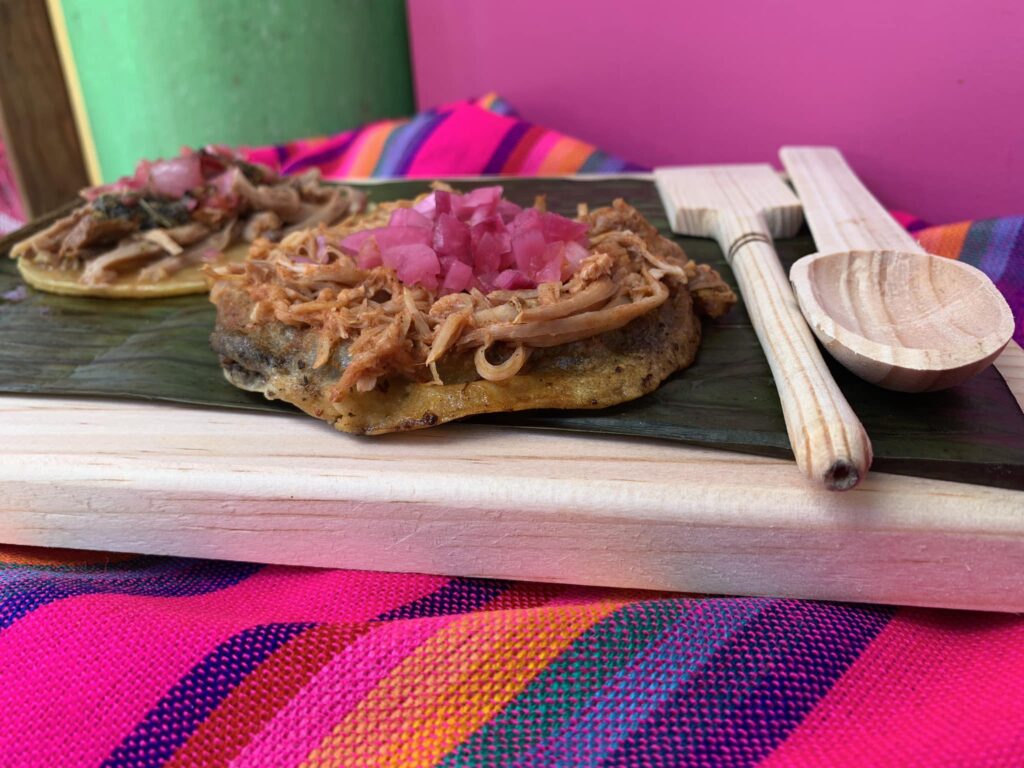 two tacos being served at La Cochi Loka taqueria in Playa Del Carmen 