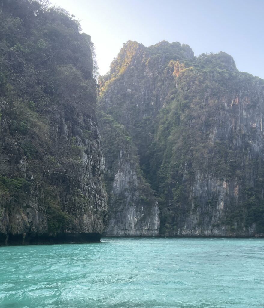 the towering limestone amongst turquoise blue waters at the Pi Leh Lagoon part of the Phi Phi islands 