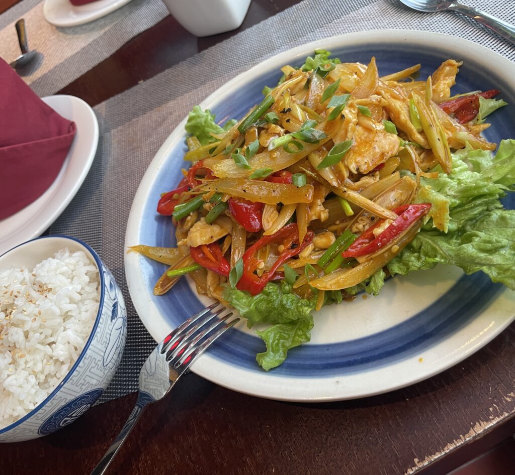 lemon pepper chicken with rice at a restaurant in Hoi An
