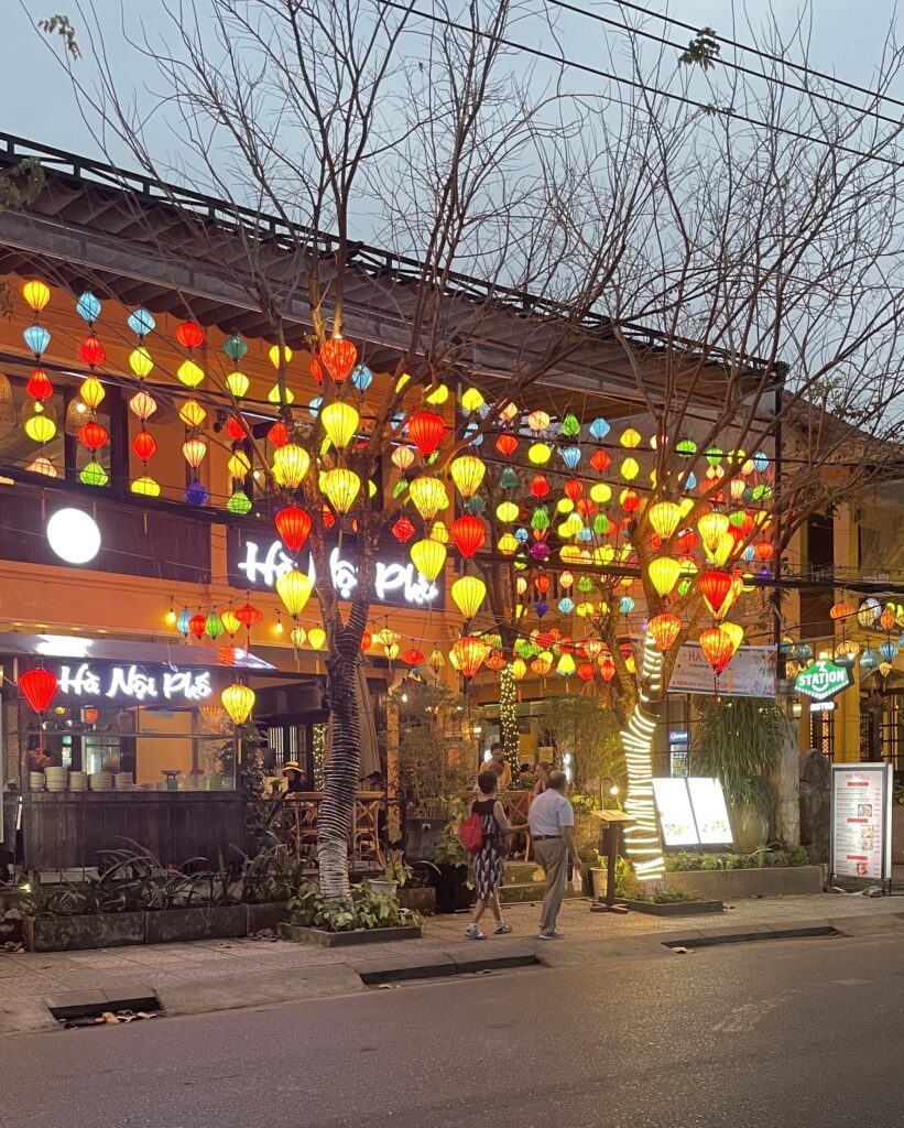 several lit lanterns at a shop in Hoi An