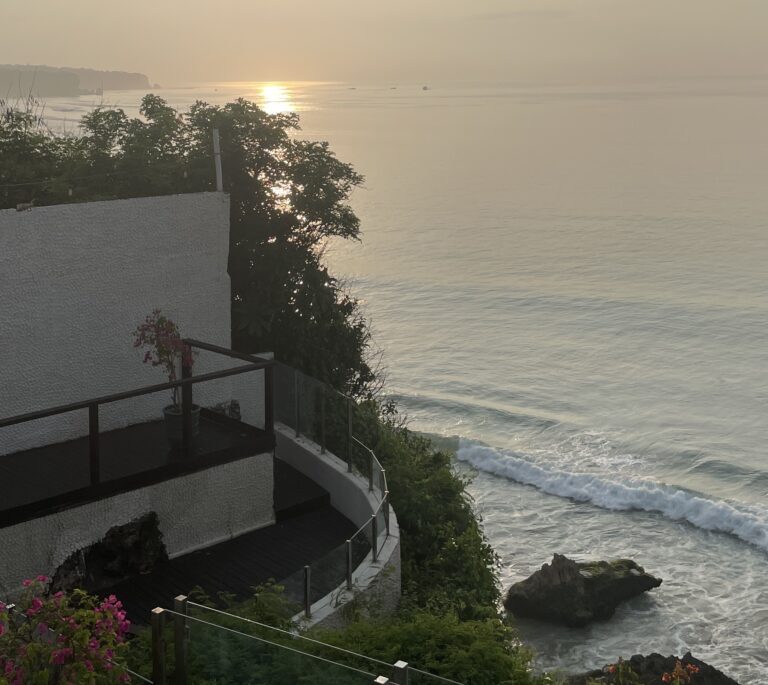 Cliffside sunset view in Uluwatu, one of the top areas featured in this guide on where to stay in Bali.