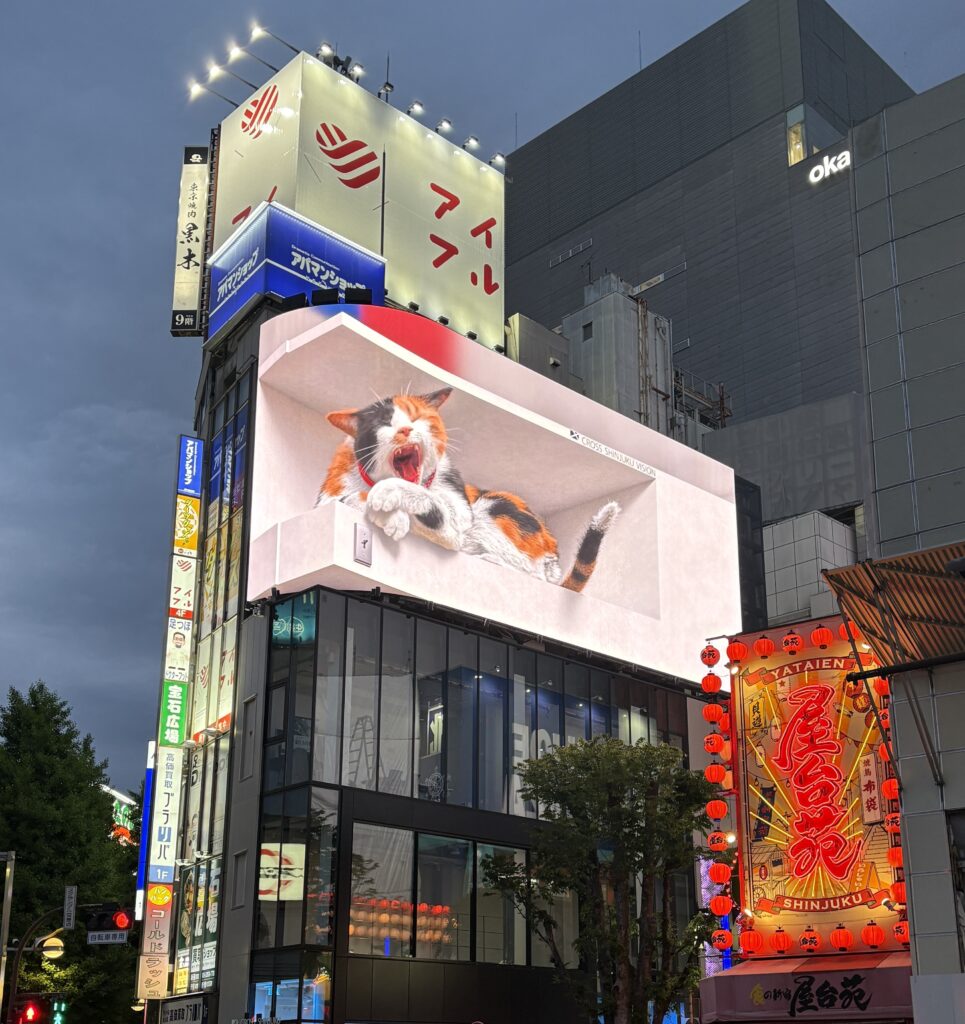 3D cat yawning on the iconic digital billboard in Shinjuku, one of the liveliest neighborhoods to stay in Tokyo