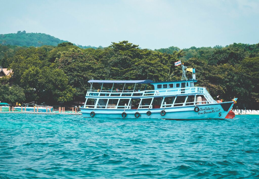 Passenger ferry cruising near Koh Samet, Thailand with travelers on board