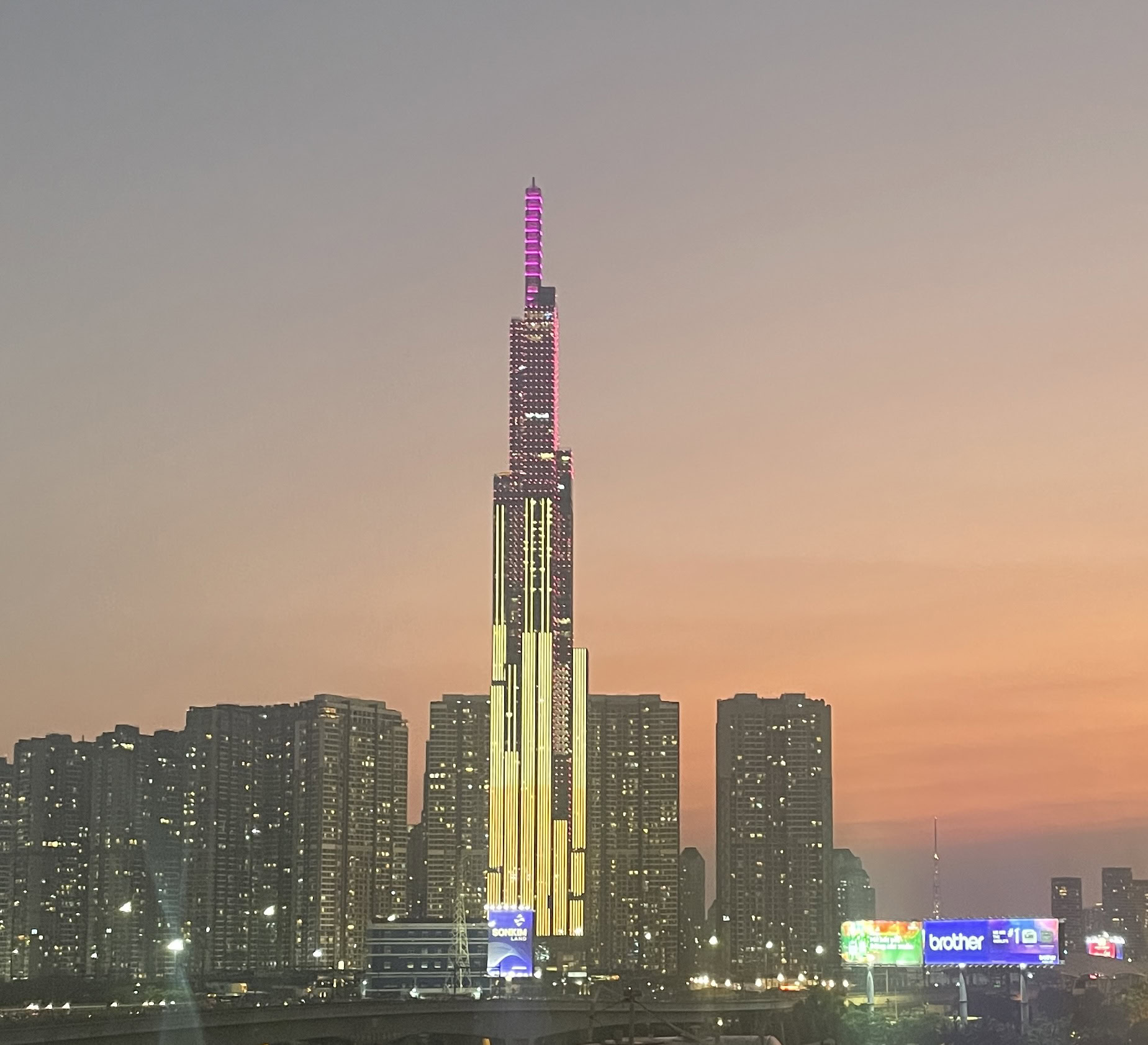 Sunset golden hour view of Landmark 81 and surrounding buildings in Ho Chi Minh City, captured from a rooftop