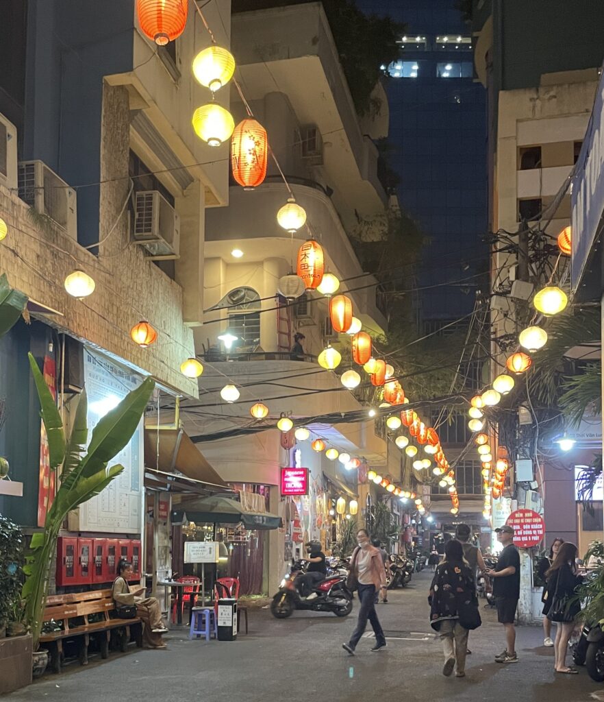 Locals and visitors walking through the cozy alleys of the Little Japan area in Ho Chi Minh City