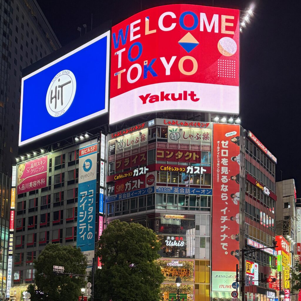a billboard with a large Welcome to Tokyo sign at Shibuya Crossing in Shibuya, Tokyo