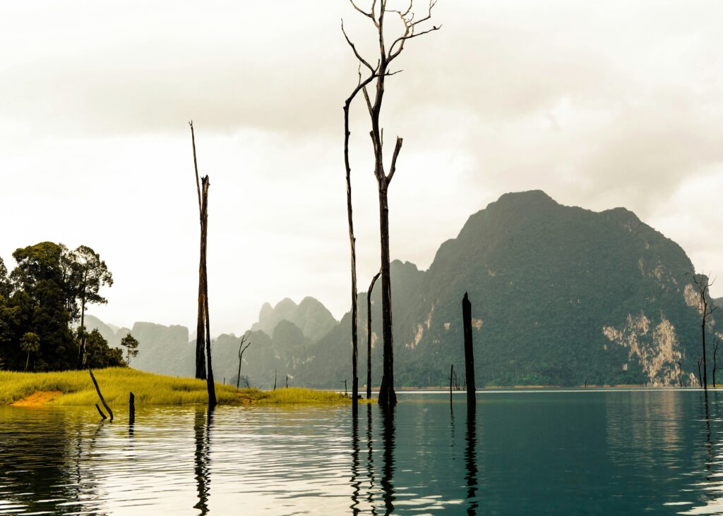 Khao Sok National Park with clouds clearing and sunlight breaking through after the rain.
