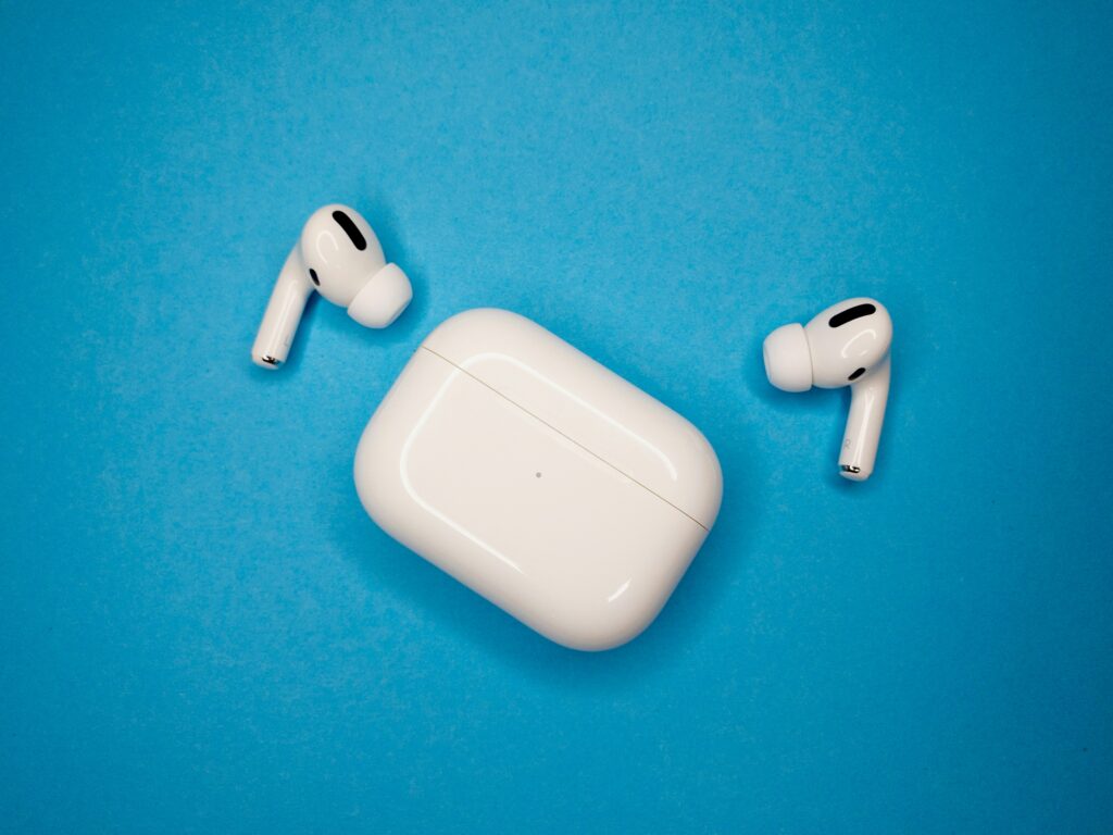 Apple AirPods Pro displayed on a vibrant blue background