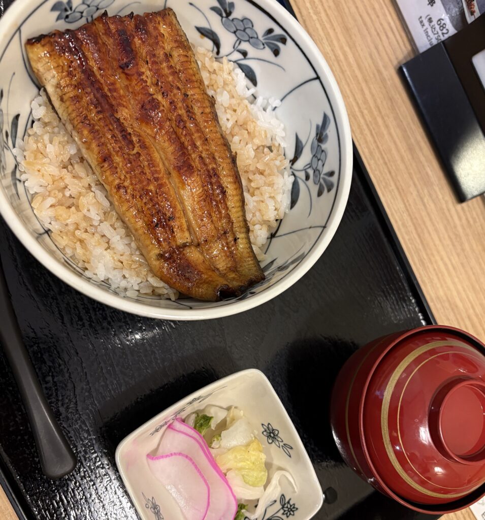 Traditional Japanese unagi served over rice with soup on the side at a restaurant in Ginza, Tokyo