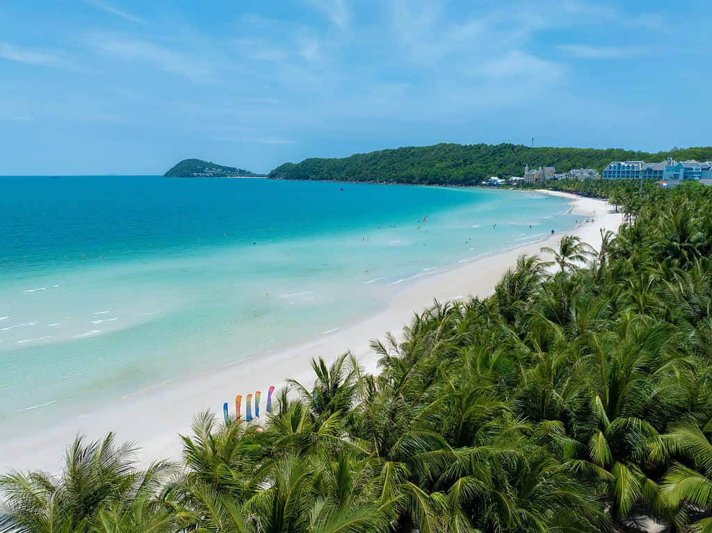 Stunning view of crystal-clear waters and white sand from a beachfront hotel in Kem Beach, Phu Quoc — a tropical island paradise.