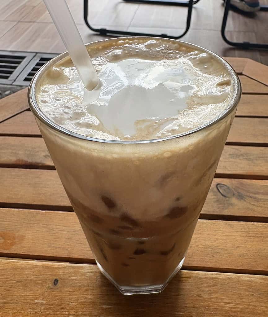Close-up of a creamy salt coffee served at a cozy café in Saigon, Vietnam.
