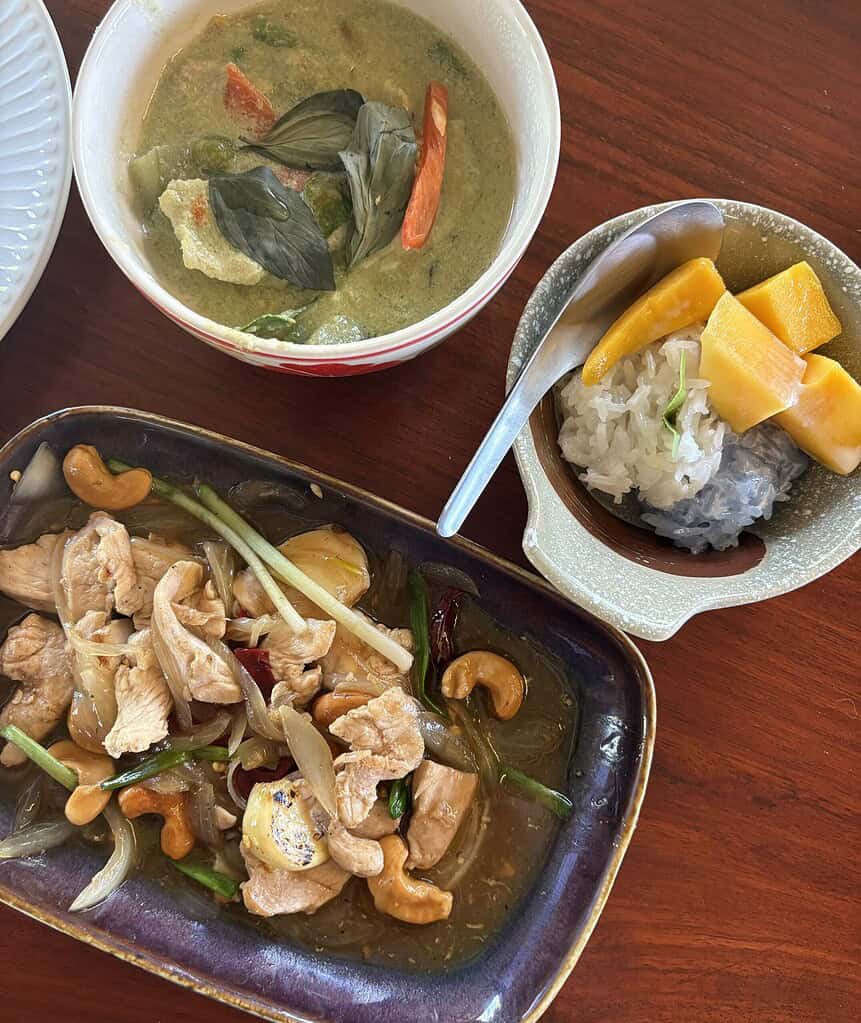 Thai green curry, chicken cashew nut stir fry, and mango sticky rice served at a Chiang Mai cooking class, Thailand