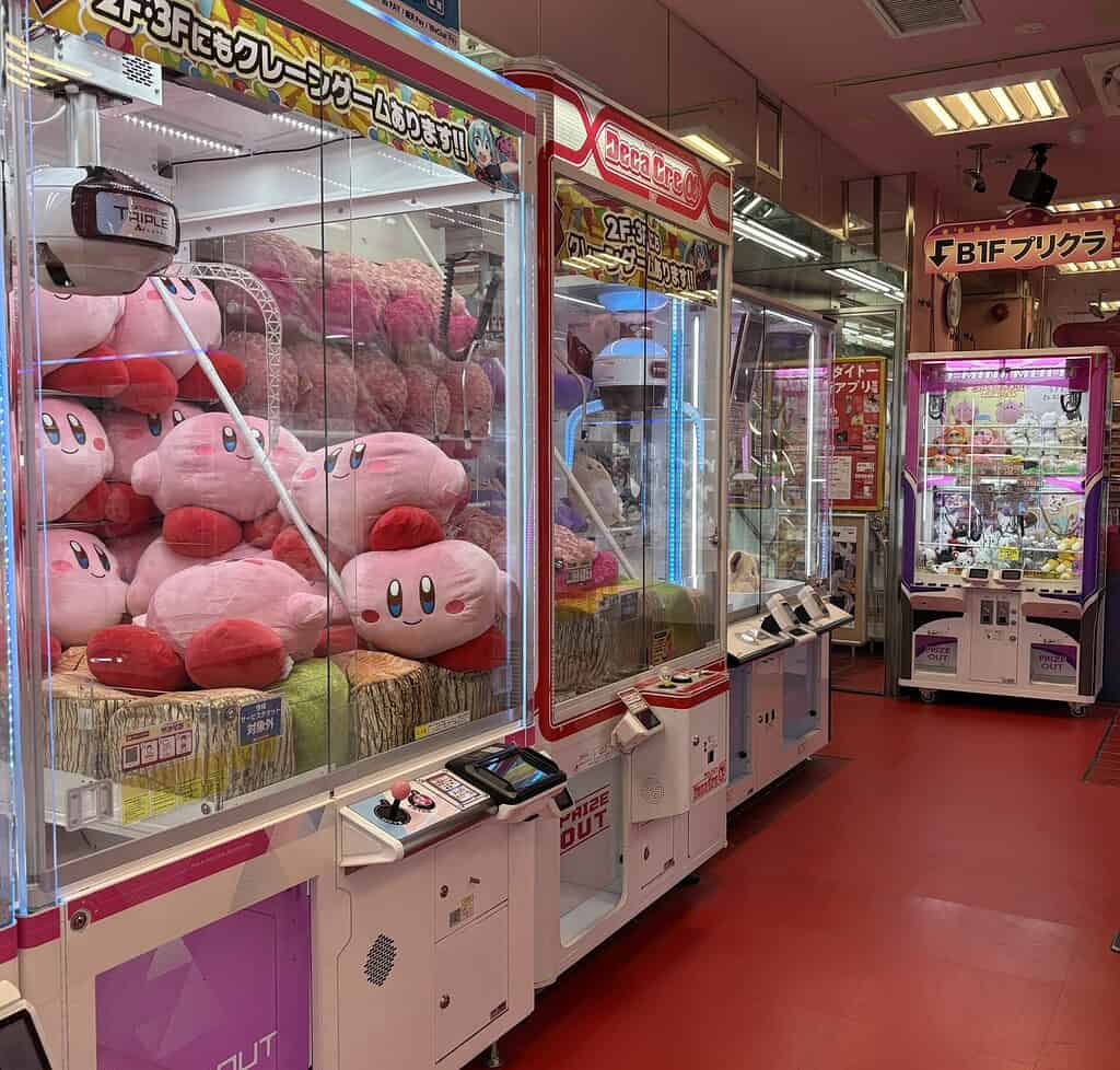 Large colorful arcade game machines inside a Japanese gaming arcade in Japan