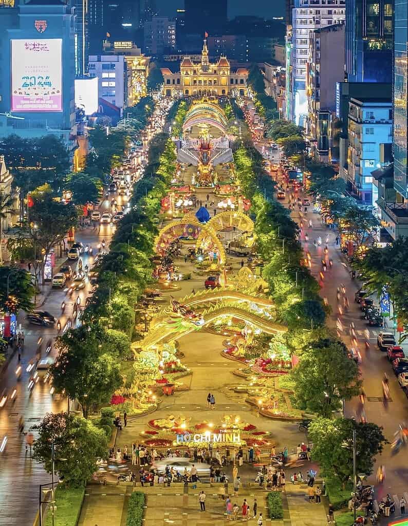 Aerial view of Nguyen Hue Boulevard in Ho Chi Minh City Vietnam lit up with elaborate Tet decorations and dragon sculptures at night