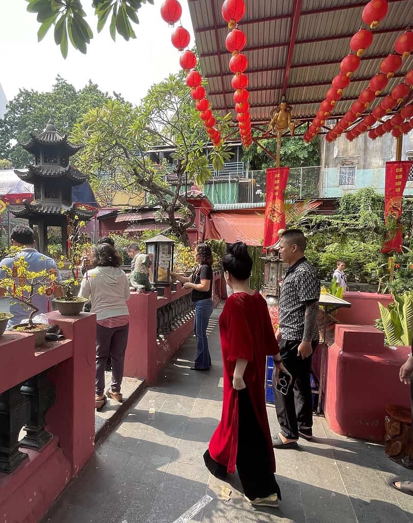 locals participating in lighting of candles during Tet in Saigon 