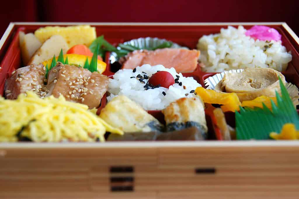 bento box filled with various Japanese foods 