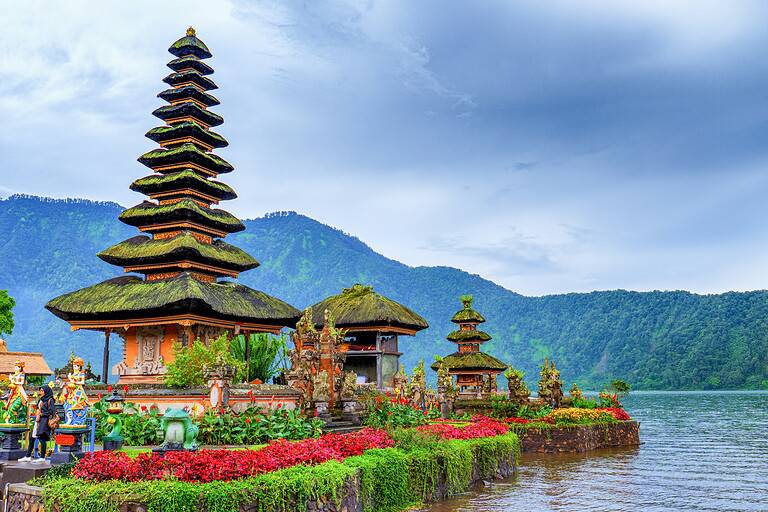 stunning temple alongside water and mountains in Bali, Indonesia