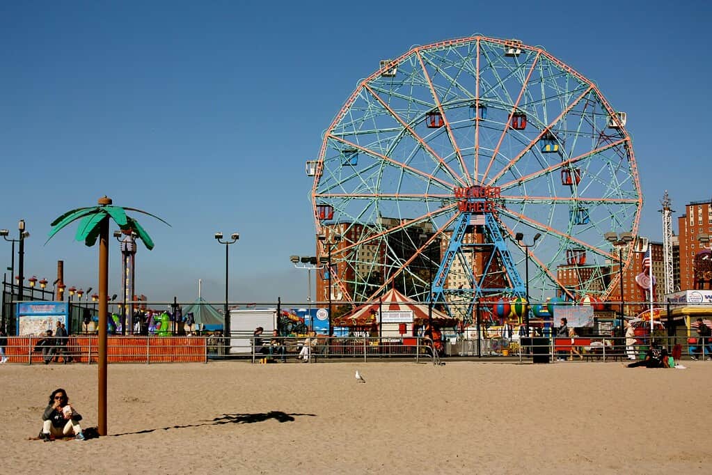 view of Coney island the ferry, park from the beach in the Summer 