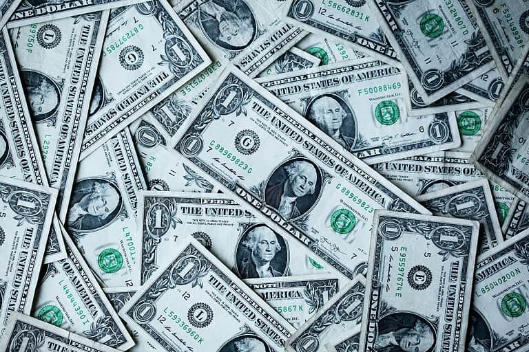 several US dollar bills layed out